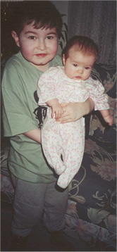 Matthew Standing AND Holding Emma